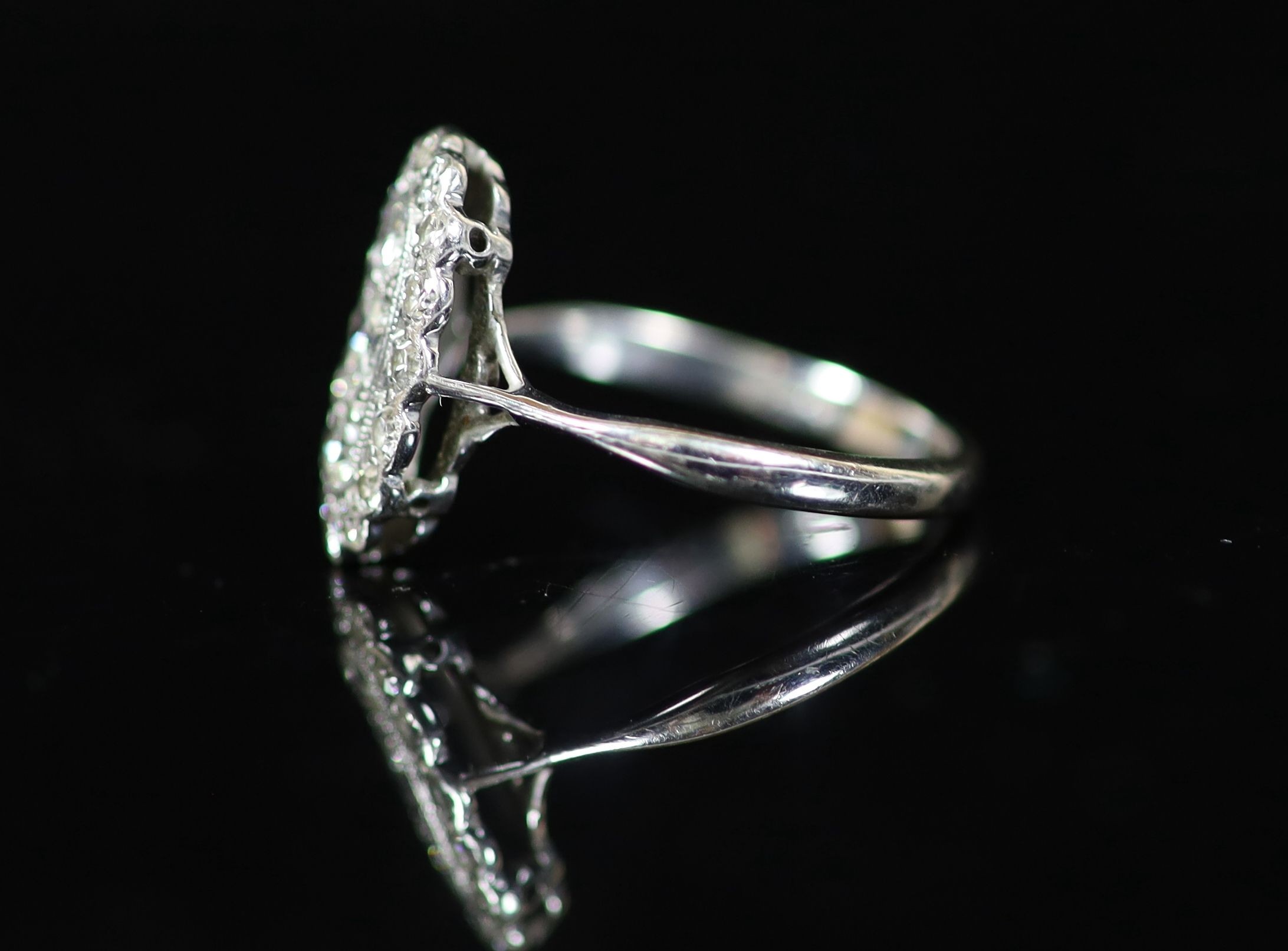 A 1940's 18ct white gold and diamond set oval cluster ring